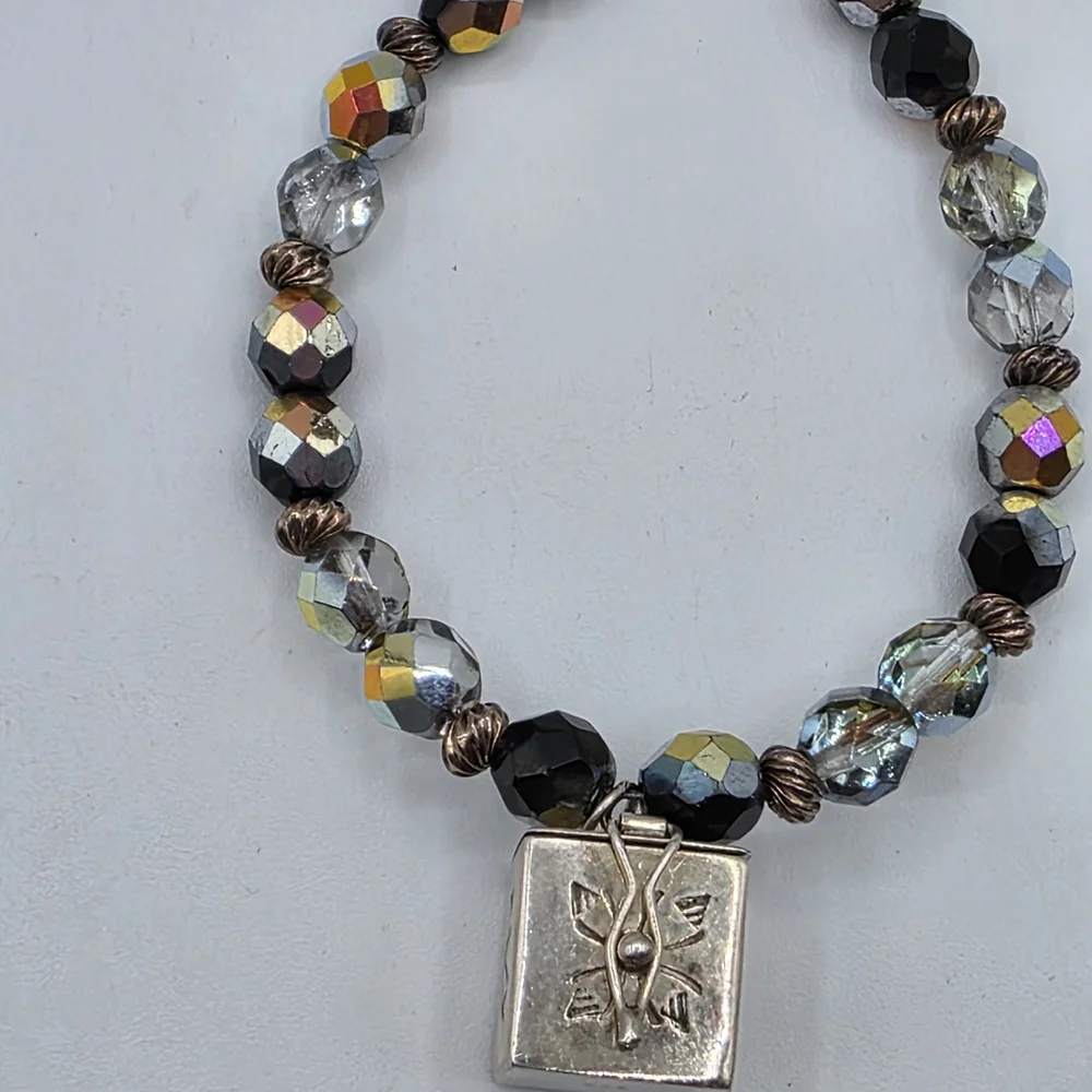 Elegant Black and Gold Charm Bracelet
